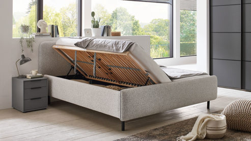 Bettgestell Meise.möbel aus Metall Stoff in Grau Polsterbettgestell PRIMO mit Lattenrost + Bettkasten hellgrauer Stoffbezug & schwarze Metallfüsse - Liegefläche ca. 180 x 200 cm